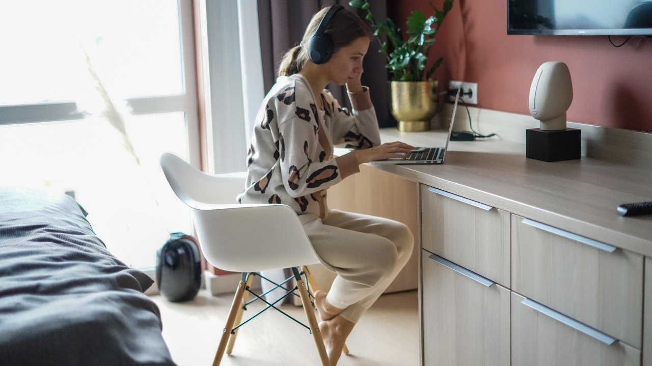 woman working from her laptop in her room